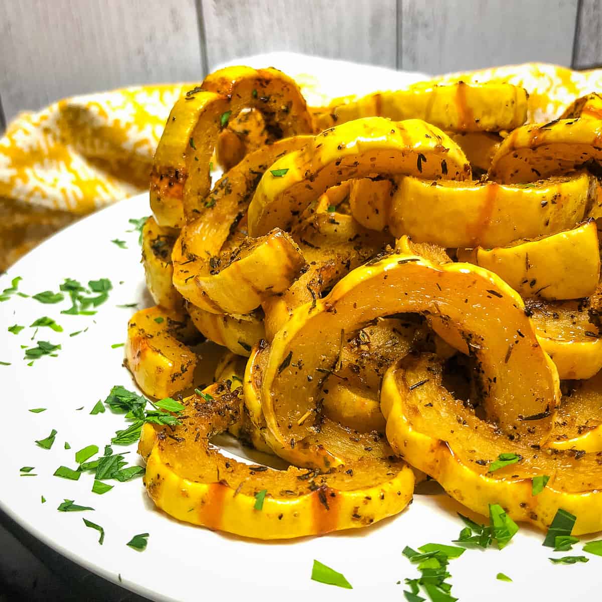 Close up of Roasted Delicata Squash on a white plate